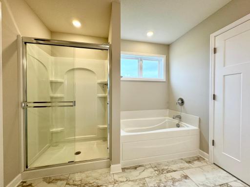 Another view of the owner's bath! Photos of similar home, actual colors and finishes may vary.