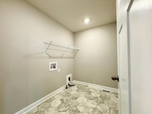 Convenient upper level laundry! Photos of similar home, actual colors and finishes may vary.