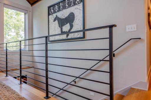 Head to the lower fully finished walk out level where you find the family room, two additional guest bedrooms, and additional laundry..jpg