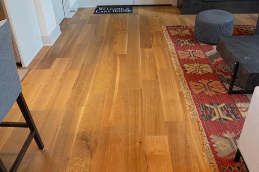 Elegant wide plank wood floors encompass the main level..jpg