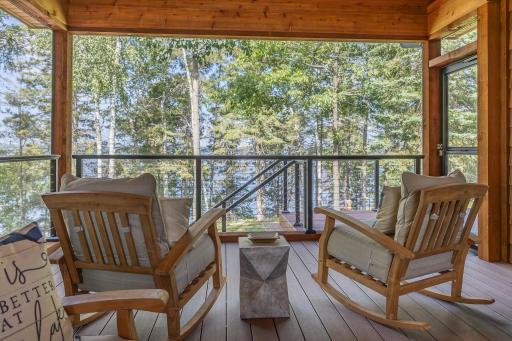 Enjoy time relaxing in the screen porch overlooking the lake..jpg