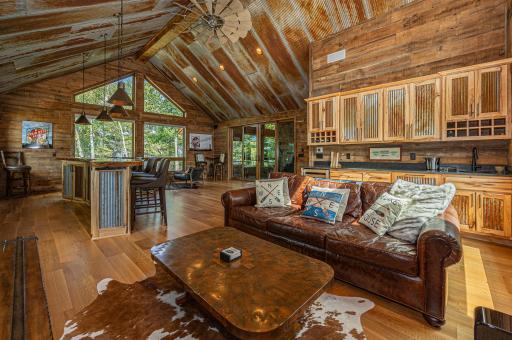 Celebrate life and toast friendships in the bar room, complete with vaulted tin ceilings, gorgeous live-edge wood bar, media area, wine cooler.jpg