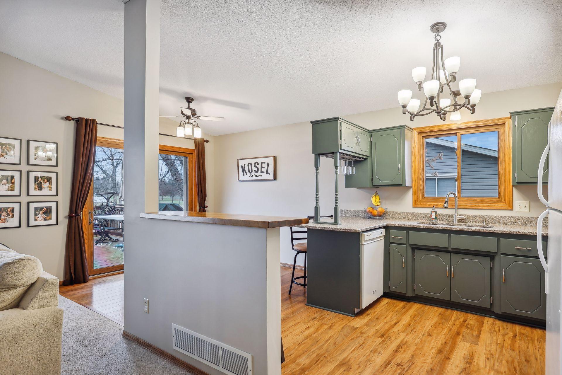 New Pergo wood laminate flooring installed in 2019 and breakfast bar added in 2021.