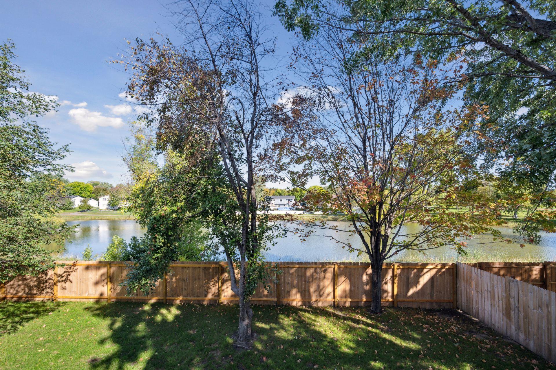 Private backyard with gorgeous view of the pond behind.