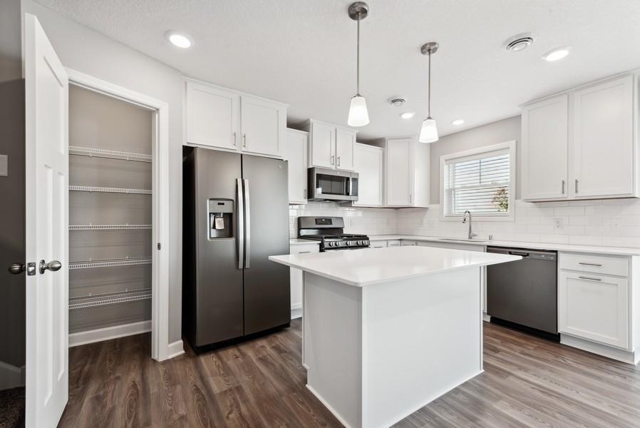 Have the pantry and cabinet space you have been wanting in the Madison! (Photo of a completed home, actual home's finishes may vary slightly)