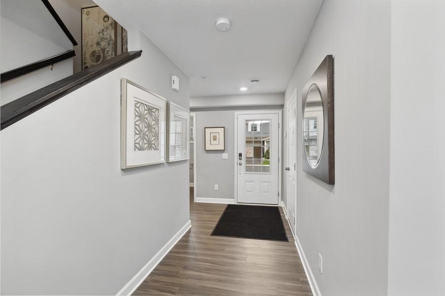 Make the best first impression with this bright and open foyer. Thoughtfully-designed to leave plenty of room for your guests to arrive and feel comfortable. (Photo of decorated model, actual home's finishes may vary slightly)