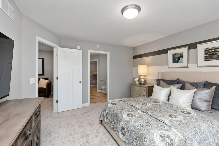 This private owner's suite boasts an abundance of space for a king-sized bed an many other furniture arrangements. (Photo of decorated model, actual home's finishes may vary slightly)