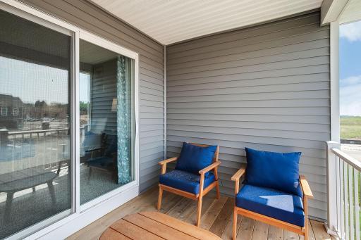 The primary bedrooms private covered balcony is sure to be your favorite space for morning coffee or a quiet cup of tea. *Photo of model home, some selections and colors may vary.