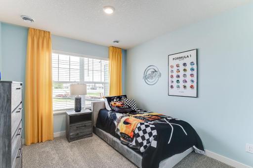 Two additional bedrooms are located on the upper level. *Photo of model home, some selections and colors may vary.