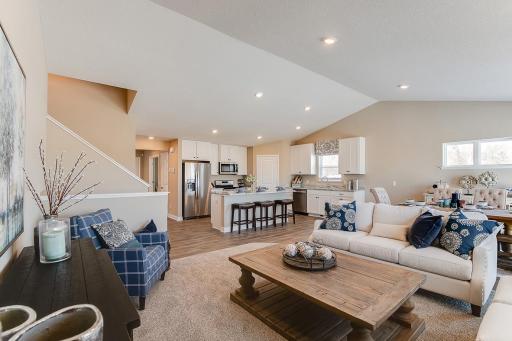 Photo for 12046 71st Street NE, Otsego, MN 55330 - Listing #6472526 Main level living room and a glimpse of the entryway, guests arrive and flow right into the main floor. Model home photo, colors and selections may vary.