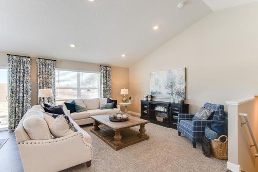 Photo for 12046 71st Street NE, Otsego, MN 55330 - Listing #6472526 Main level living room area, enough space to accommodate many different furniture arrangements. Model home photo, colors and selections may vary.