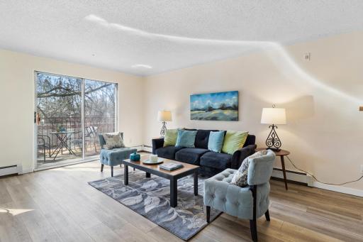 A generous Living Room is filled with southern light & easy to arrange