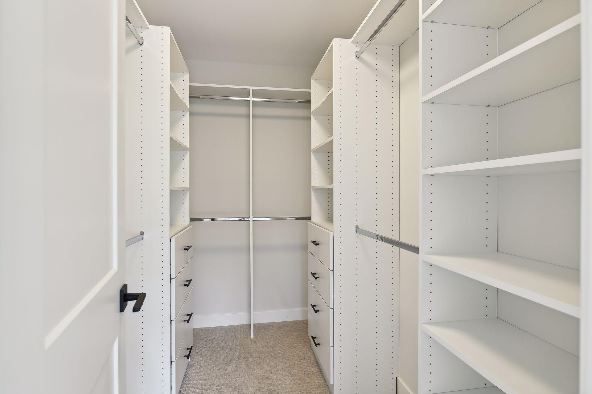 1 of 2 Walk-in closets in primary