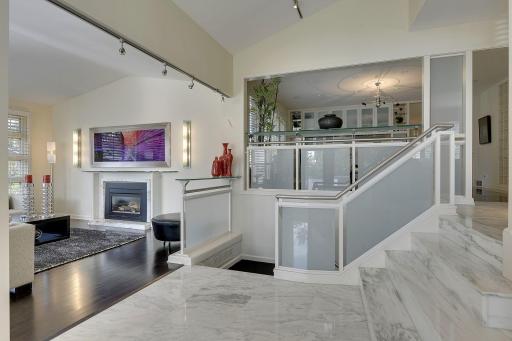 Four steps up from foyer and living room level to the main level