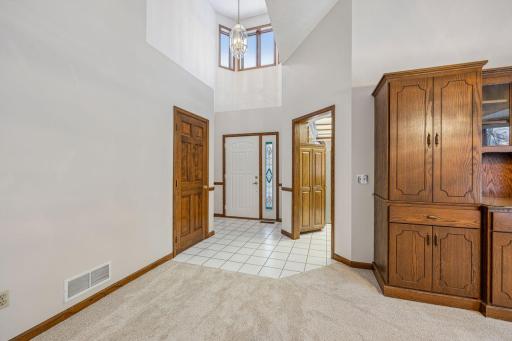 Spacious entry way has portico with windows that bring the western sunshine into entry.