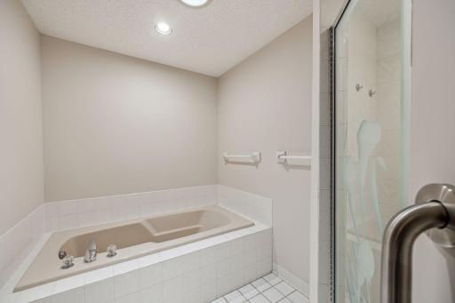 Nice deep soaking tub with tile floor and separate walking shower. Enjoy the solo tube for added natural light.