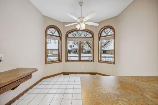 Unique informal dining space with roundtop windows with stainglass inserts (removeable)