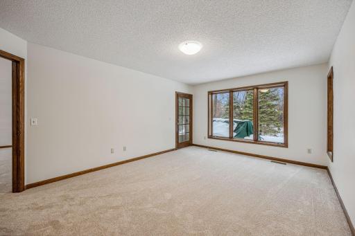 A true genious to this townhome design is this family room. It has a door so it can be private. Use it as an office, a place where the T.V. can be turned up and enjoyed! And the plus is it has a door to the patio to enjoy nature.