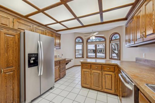 No downsizing with this kitchen with ample cubboard space, a built in desk, and great countertop workspace.