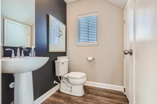 Powder bath off of main level for added convenience. (Photo of decorated model, actual home finishes may vary slightly)