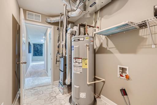 Upper level laundry and mechanical room for convenience! (Photo of decorated model, actual home finishes may vary slightly)