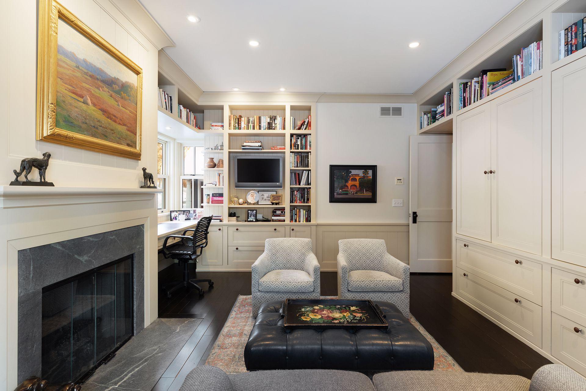 Two work stations, built-in cabinetry and seating area.