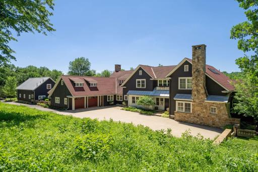 A terrace like entry drive creates a platform for the beautiful architecture of the home.