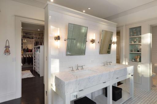 The generous walk-in closet is adjacent to the bath.