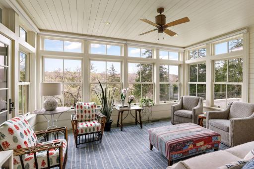 Bonus spaces on the main level include this four season "porch".