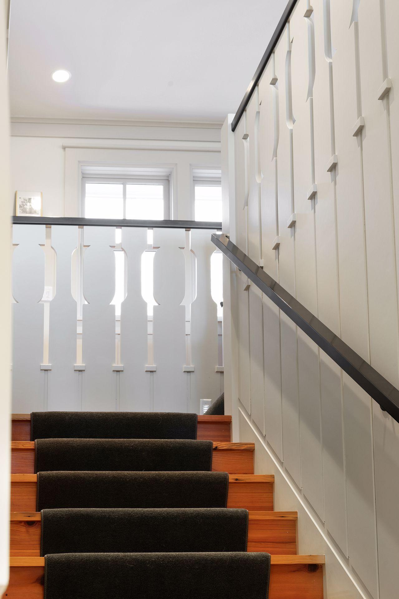 Classic details on the stairway leading to the upper level.