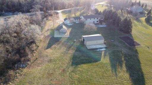 Aerial view from the backyard with pole shed and parking area