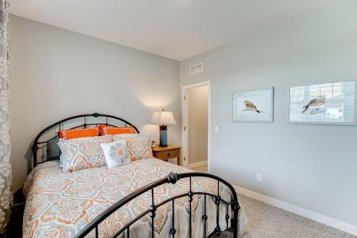 The Henley offers a highly sought after main floor bedroom! Photo of model home, color & options may vary.