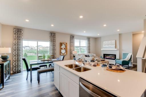 Large eating area off the kitchen is perfect for meals at any time of the day. Photo of model home, color & options may vary.