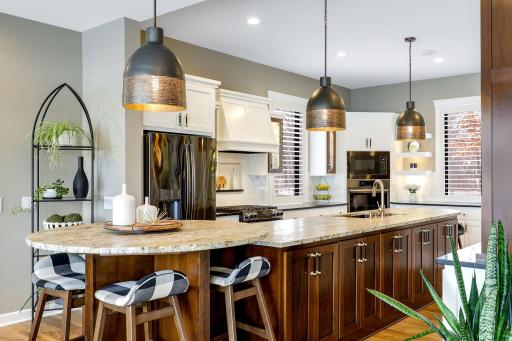 Custom cabinetry with leathered granite on the island