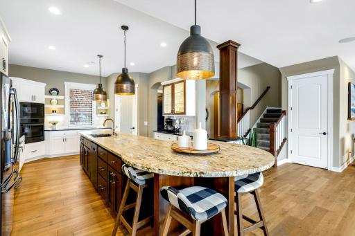 Oversized island with raised breakfast top at the end provides another eating area
