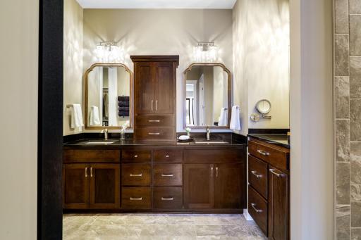 Primary bathroom with dual vanity and makeup counter