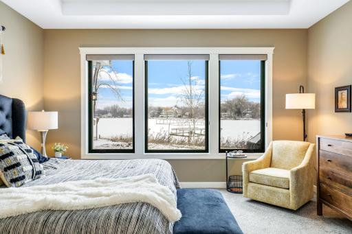 Primary bedroom with expansive lake views