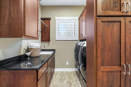 Laundry room is conveniently located just across the hall from the primary bathroom and closet