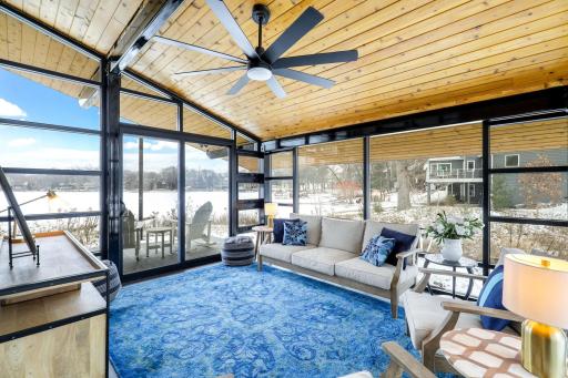 Main level glass enclosed sunroom with heated floors