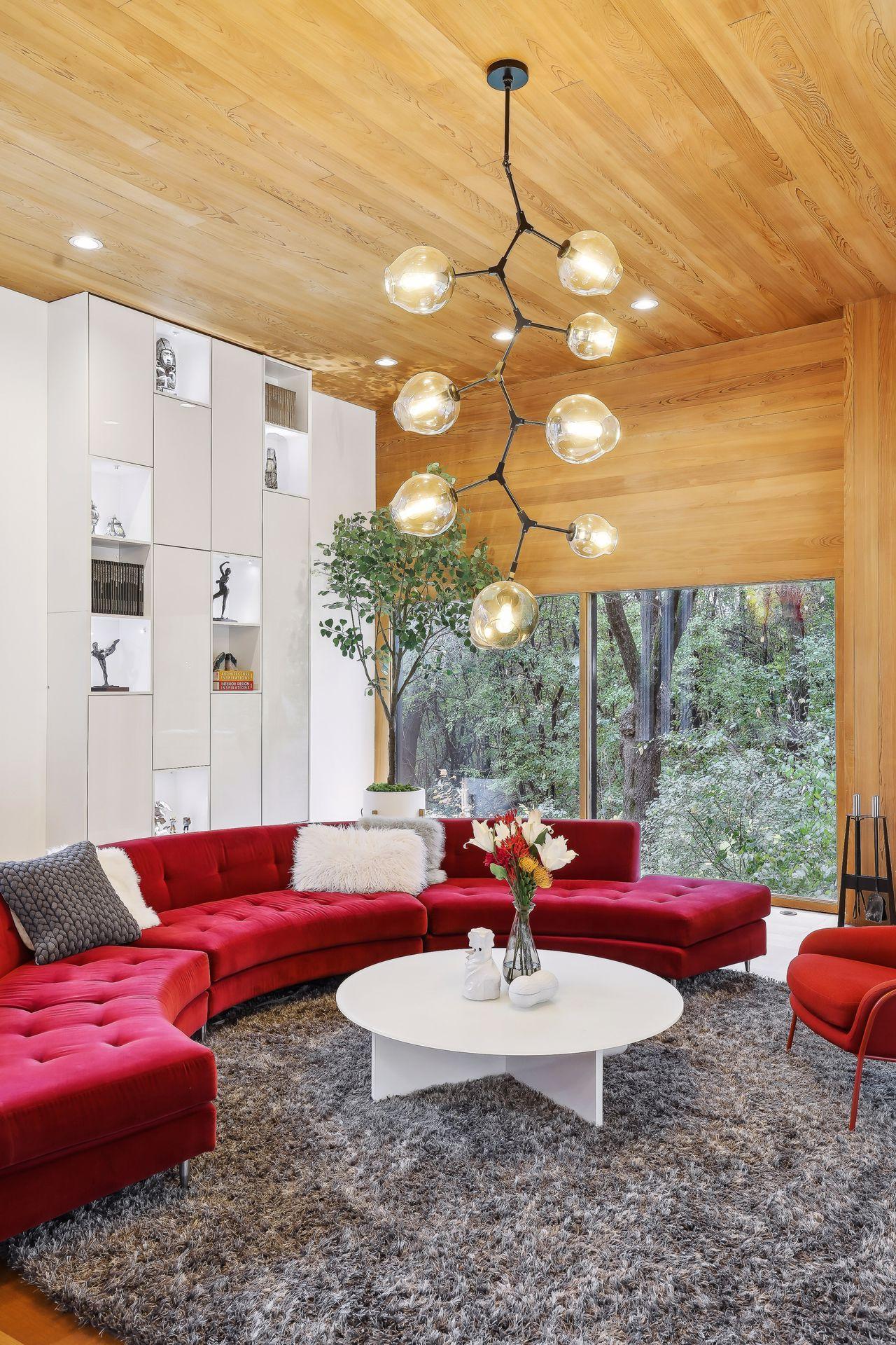 12' Ceilings, 12' Built in Custom Bookshelf, 12' Wood burning fireplace all completely private amongst floor to ceiling windows.