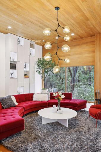 12' Ceilings, 12' Built in Custom Bookshelf, 12' Wood burning fireplace all completely private amongst floor to ceiling windows.