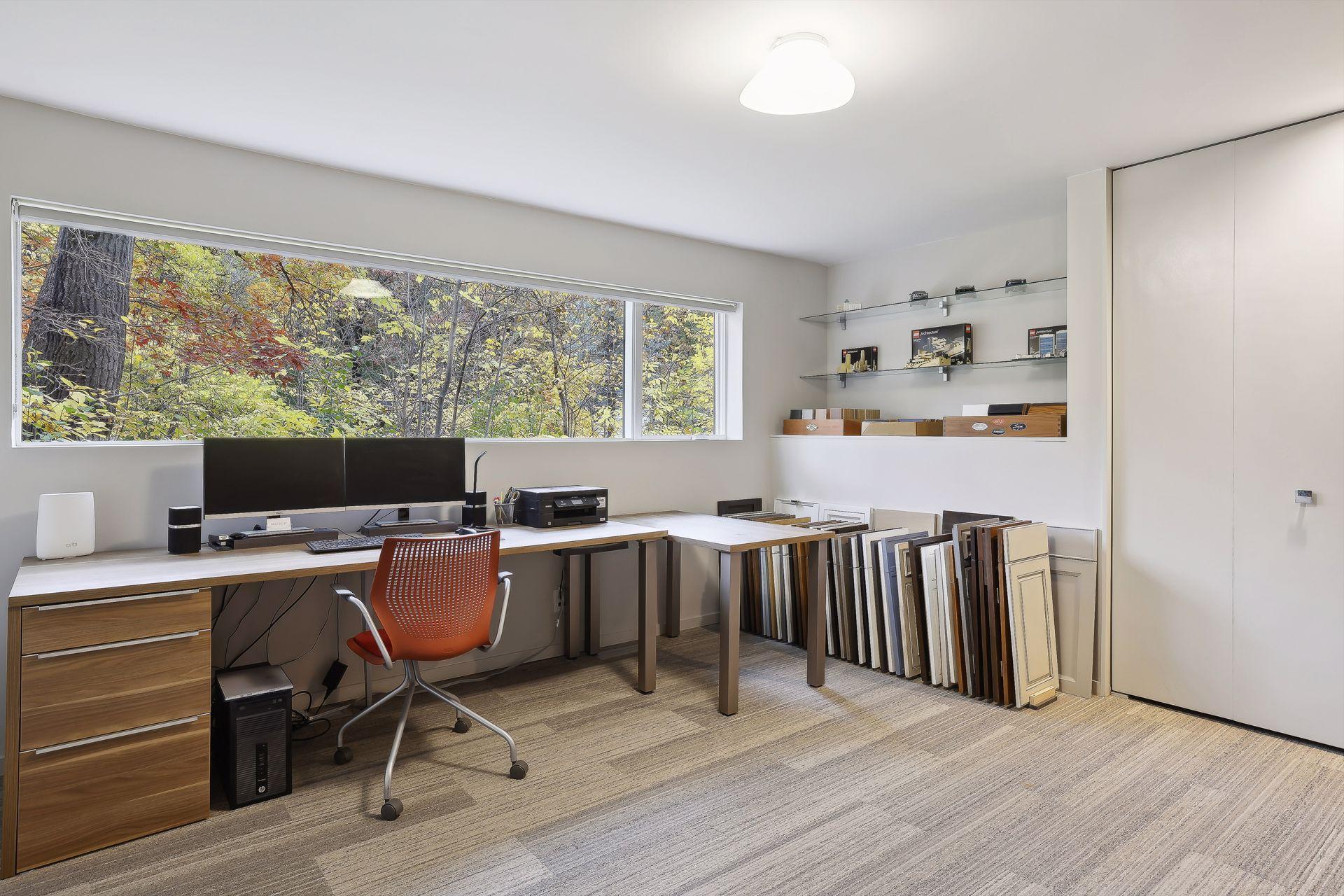 One of the bedrooms is used as a home office with stunning treetop views.