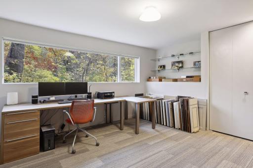 One of the bedrooms is used as a home office with stunning treetop views.