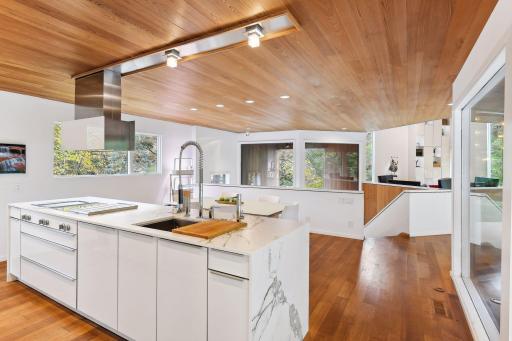 Leicht Cabinetry Acrylic High Gloss White from Germany reflects the outdoor scenery.