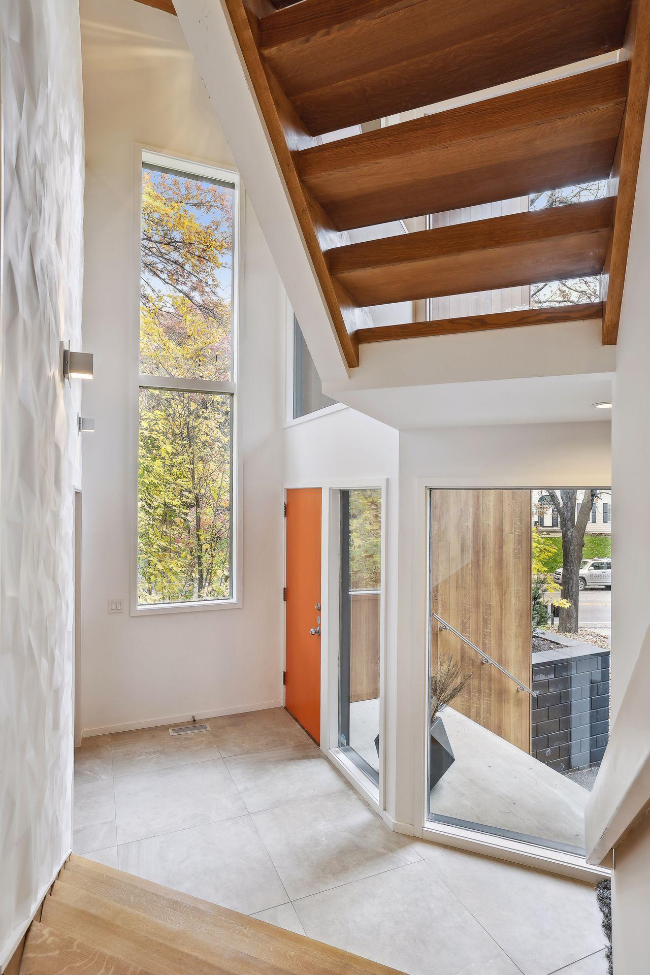 The elevation of this level leaves with tree top views and sun light gleaming through expansive windows