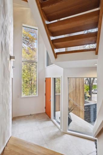 The elevation of this level leaves with tree top views and sun light gleaming through expansive windows