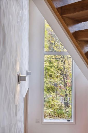 The 16' entry wall with three-dimensional plaster and heated floor under large format Italian Tile