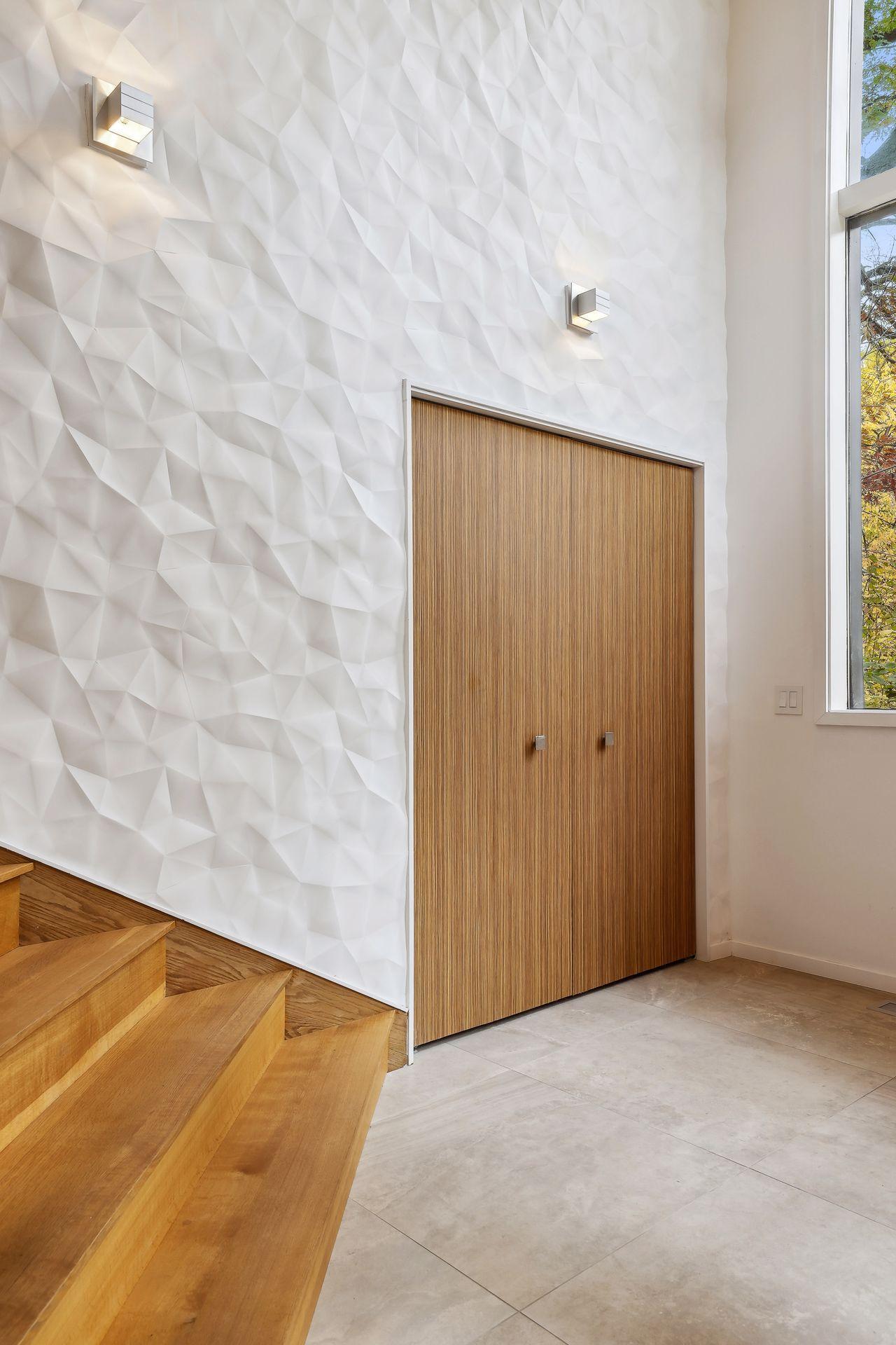 The foyer is light, expansive and a literal piece of art.