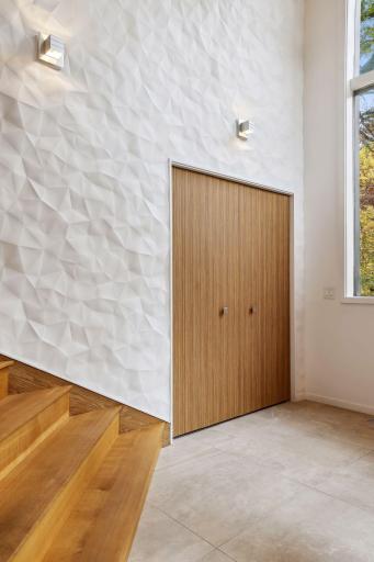 The foyer is light, expansive and a literal piece of art.