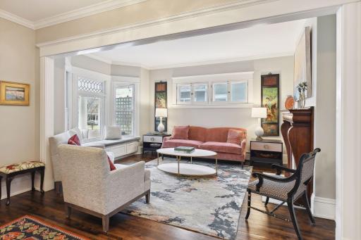 Lovely natural light filters through large front windows and pretty leaded glass.